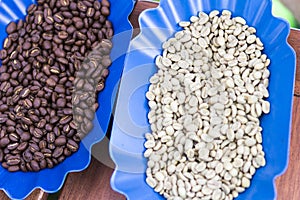 Two boles with fresh coffee and roasted coffee