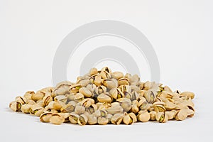 Fresh roasted pistachio nuts isolated on white. Pistachio nuts on white background.  Product for sale.   Copy space.