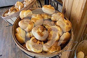 Fresh rolls, bread on the shelf in the bakery.