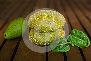 Two green buns with sesame seeds close up