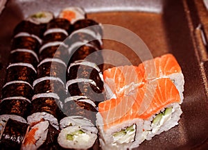 Fresh rolls and sushi, with vegetables and fish