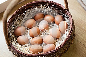 Fresh rooster eggs in the basket in organic store.