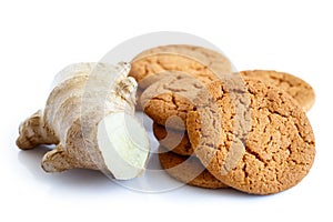 Fresh root ginger with ginger biscuits.