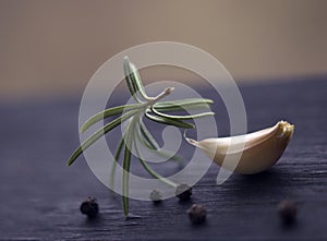 Fresh rosemary is dancing with garlic photo