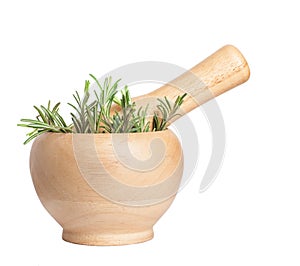 Fresh rosemary herb in wooden mortar with pestle