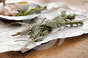 Fresh rosemary twigs on table