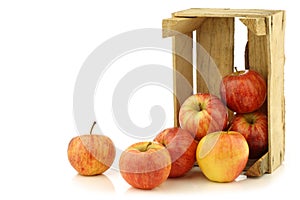 Fresh royal gala apples in a wooden crate