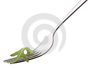 Fresh rucola salad on fork isolated on white background cutout.