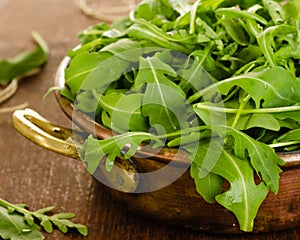 Fresh rucola salad leaves in bowl