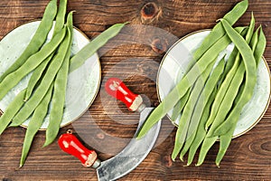 Fresh runner beans on wooden background