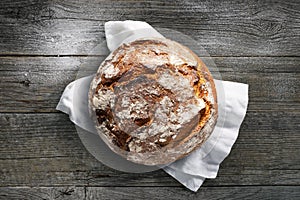 Fresh rustic bread on a wooden table