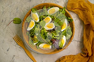 Fresh salad, boiled eggs organic  in a plate healthy delicious