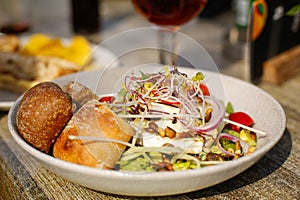 Fresh salad with bread and onion rings