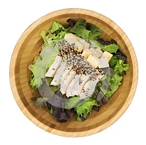 Fresh salad with chicken breast quinoa, baked bread in a wooden Tray And pumpkin salad dressing on the red cloth isolate white