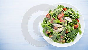 Fresh salad with chicken, tomato and greens (spinach, arugula)