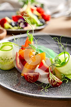 Fresh salad in clay plate