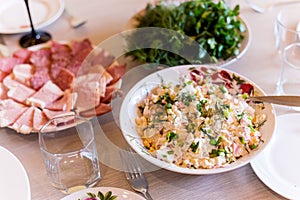 Fresh salad with corn and crab meat with mayonnaise on a festive table