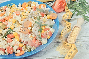 Fresh salad with couscous and vegetables. Light dietary vegan meal