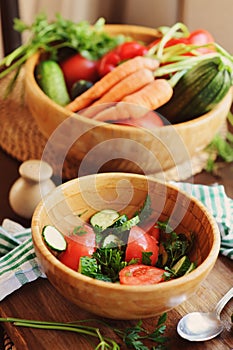 fresh salad with cucumbers and tomatoes picked from farm garden