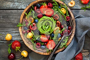 Fresh salad with fruit,berry and vegetables.