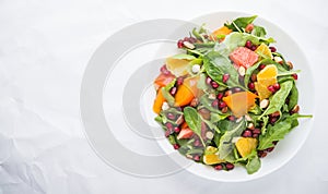 Fresh salad with fruits and greens