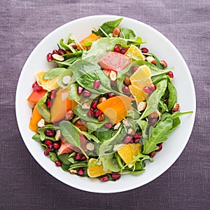 Fresh salad with fruits and greens