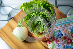 Fresh salad in a glass jar.