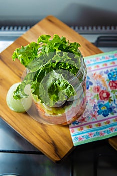 Fresh salad in a glass jar.