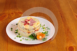 Fresh salad with mayonnaise, sausage, potatoes, pepper