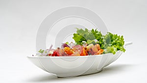 Fresh Salad with Onion and Tomatoes isolated on White background.