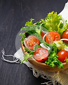Fresh salad with tomato, frisee and onion