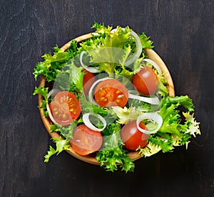 Fresh salad with tomato, frisee and onion