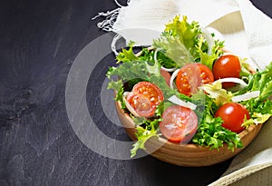 Fresh salad with tomato, frisee and onion