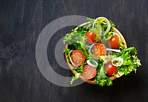 Fresh salad with tomato, frisee and onion