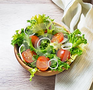 Fresh salad with tomato, frisee and onion