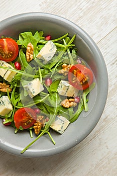 Fresh salad with tomatoes , blue cheese and nutsFresh salad with tomatoes , blue cheese and nuts