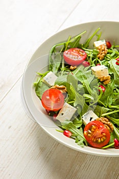 Fresh salad with tomatoes , blue cheese and nutsFresh salad with tomatoes , blue cheese and nuts