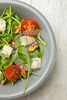 Fresh salad with tomatoes , blue cheese and nutsFresh salad with tomatoes , blue cheese and nuts