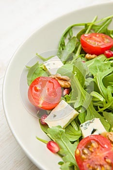 Fresh salad with tomatoes , blue cheese and nutsFresh salad with tomatoes , blue cheese and nuts