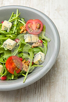 Fresh salad with tomatoes , blue cheese and nutsFresh salad with tomatoes , blue cheese and nuts