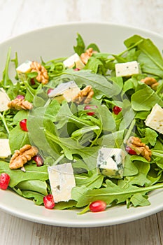 Fresh salad with tomatoes , blue cheese and nutsFresh salad with tomatoes , blue cheese and nuts