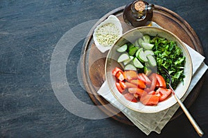 Fresh salad with tomatoes, cucumbers, herbs and hemp seeds