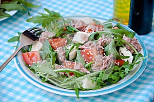 Fresh salad with tomatoes, ruccola and tuna