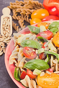 Fresh salad with wholegrain pasta and vegetables. Healthy lifestyles and nutrition. Vintage photo