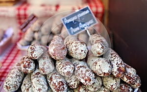 Fresh salami at farmer market in France, Europe. Italian Spanish and French salamis. Street French market at Nice.