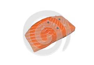 Fresh salmon fillet decorated with black pepper, pink Himalayan salt on a white background with clipping path