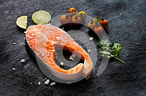 Fresh salmon fish fillet on wooden board