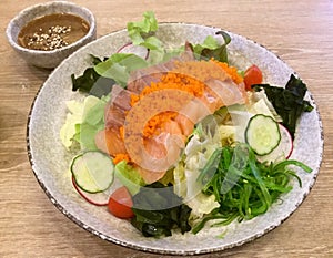 Fresh salmon salad. Seaweed. Sashimi. Japanese food.