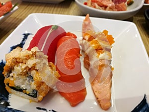 Fresh salmon sashimi slide. cooking and serv on silver plate with lemon. japanese food traditional