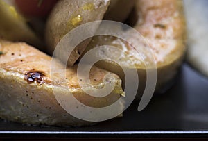 Fresh salmon served with poached potatoes and vegetable puree 12close up shot